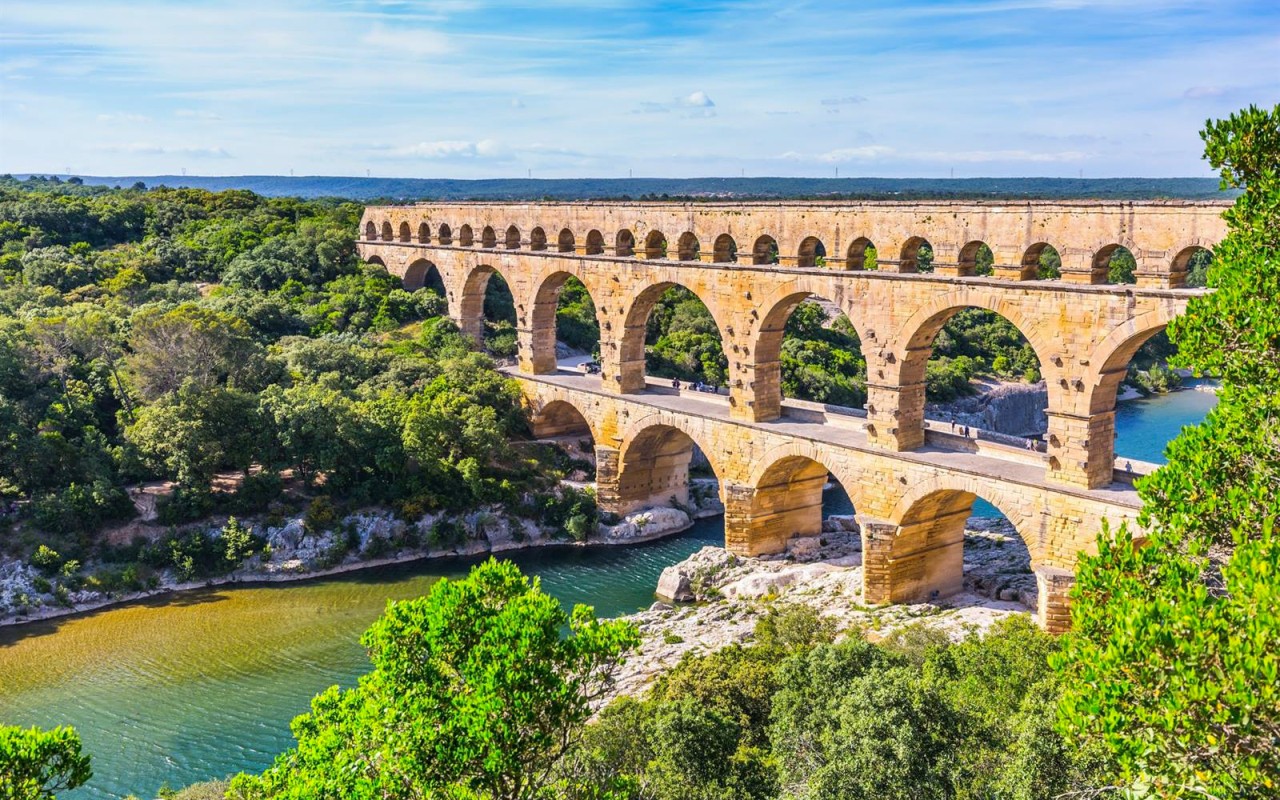 Pont du Gard reflected in the river
